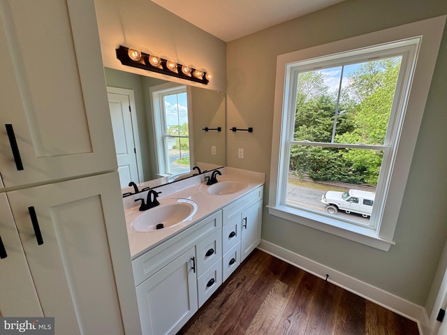 419 Kentmorr Rd, Stevensville, MD 21666 - full bath featuring baseboards, plenty of natural light, wood finished floors, and double vanity