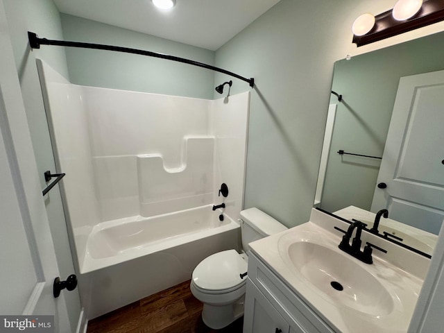 419 Kentmorr Rd, Stevensville, MD 21666 - full bath with wood finished floors, toilet, vanity, and tub / shower combination