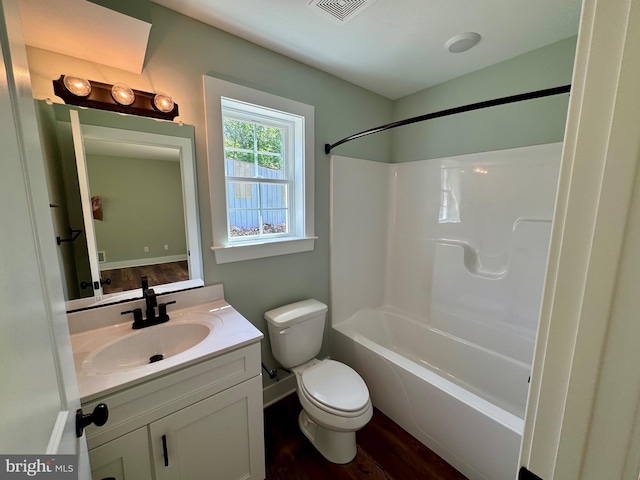 419 Kentmorr Rd, Stevensville, MD 21666 - bathroom with toilet, wood finished floors, vanity, washtub / shower combination, and baseboards