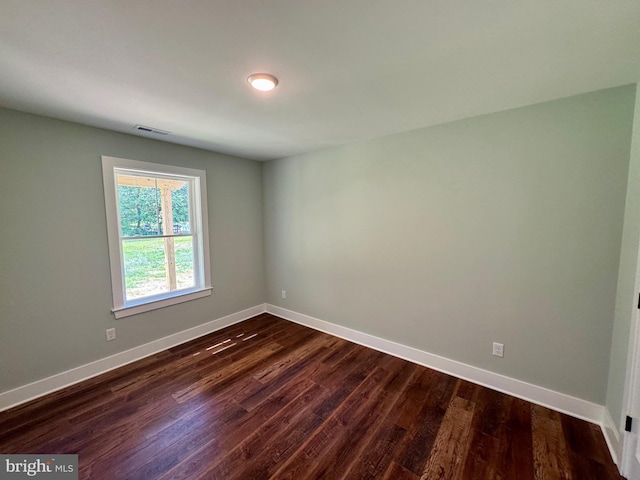 419 Kentmorr Rd, Stevensville, MD 21666 - spare room featuring baseboards and dark wood-type flooring