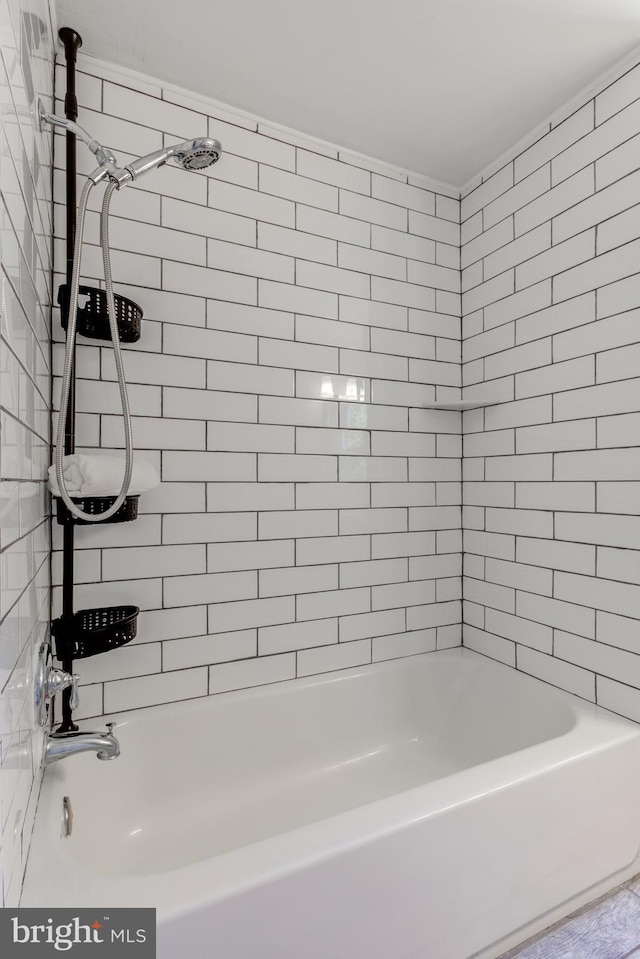 bathroom featuring  shower combination