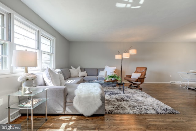 living room with wood finished floors and baseboards