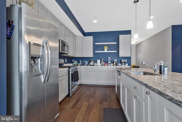 kitchen with open shelves, appliances with stainless steel finishes, dark wood-type flooring, white cabinets, and a sink