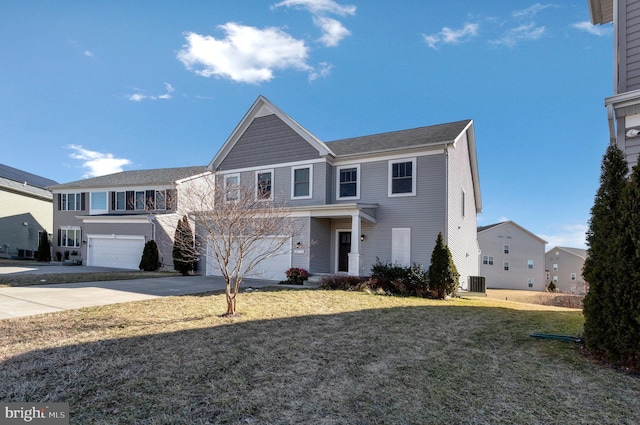 view of front of house with driveway, an attached garage, cooling unit, and a front yard