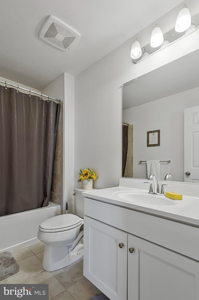 bathroom with toilet, vanity, visible vents, tile patterned floors, and shower / bath combination with curtain