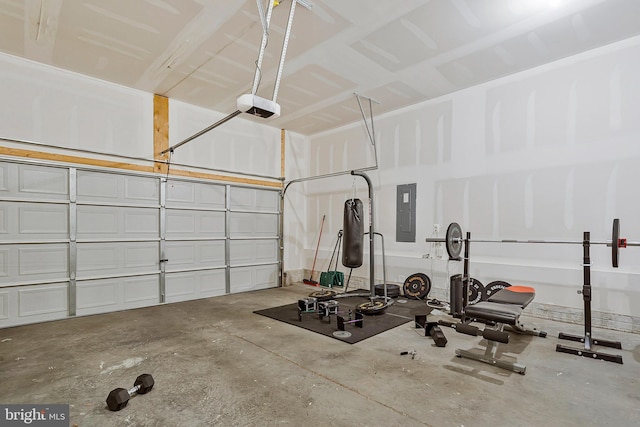 garage with electric panel and a garage door opener