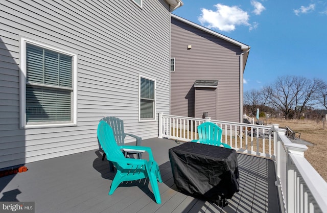 wooden terrace featuring area for grilling