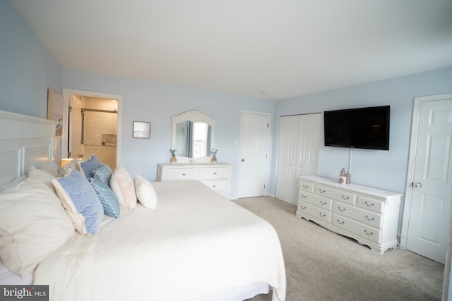 bedroom with multiple closets and light colored carpet