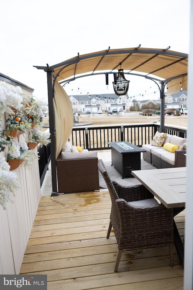 wooden deck with an outdoor hangout area