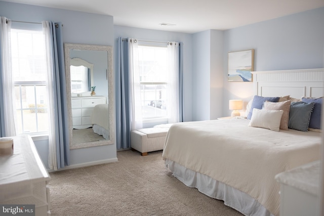 bedroom with visible vents and carpet floors