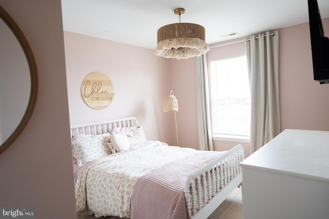 bedroom featuring visible vents