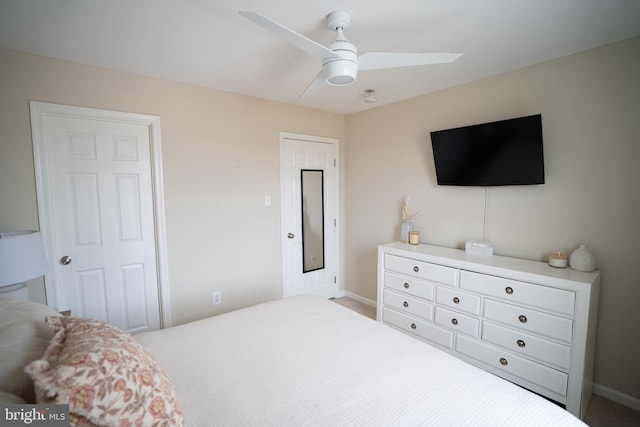 bedroom with baseboards and ceiling fan