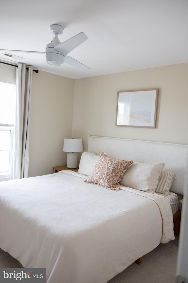 bedroom with carpet floors and a ceiling fan