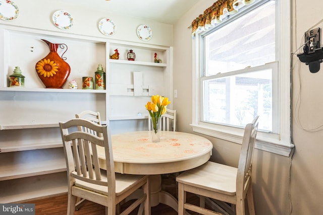 dining area with wood finished floors