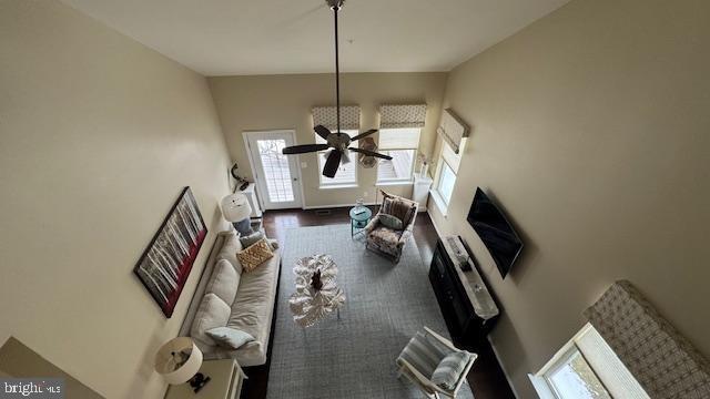 living room featuring a ceiling fan