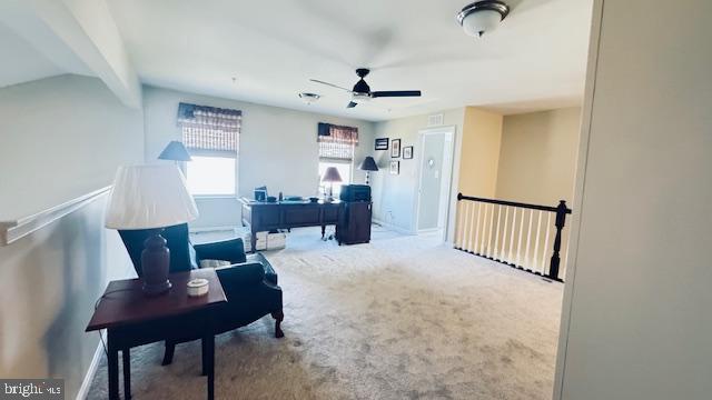 office space with carpet flooring and ceiling fan