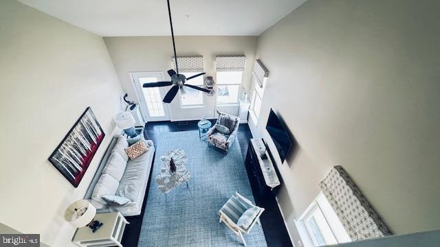 living area with ceiling fan