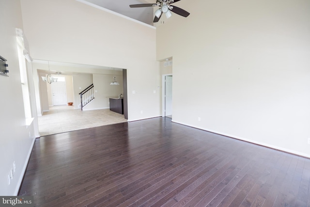 2820 Union Square Rd Unit 5, New Windsor, MD 21776 - unfurnished living room with a high ceiling, ceiling fan, wood finished floors, baseboards, and crown molding