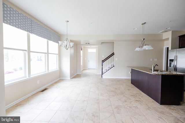 2820 Union Square Rd Unit 5, New Windsor, MD 21776 - kitchen featuring stainless steel fridge, a sink, light stone counters, pendant lighting, and dark brown cabinets