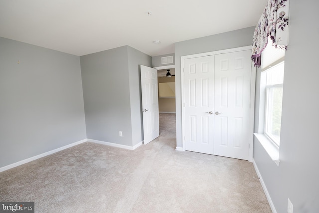 2820 Union Square Rd Unit 5, New Windsor, MD 21776 - unfurnished bedroom featuring light carpet, baseboards, and a closet