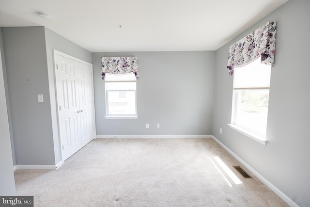 2820 Union Square Rd Unit 5, New Windsor, MD 21776 - unfurnished bedroom with multiple windows, carpet, a closet, and baseboards