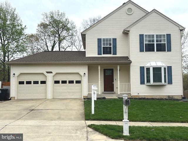 traditional-style house featuring driveway, a front lawn, an attached garage, a shingled roof, and covered porch