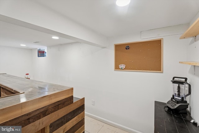 bar with tile patterned flooring, recessed lighting, and baseboards