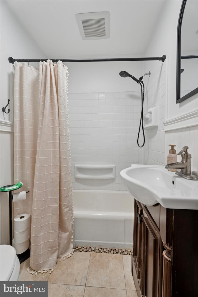 bathroom with tile patterned floors, visible vents, shower / tub combo with curtain, toilet, and vanity