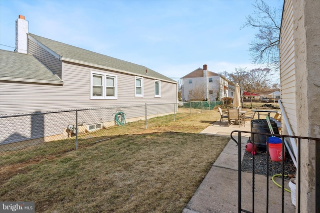 view of yard featuring a patio and fence