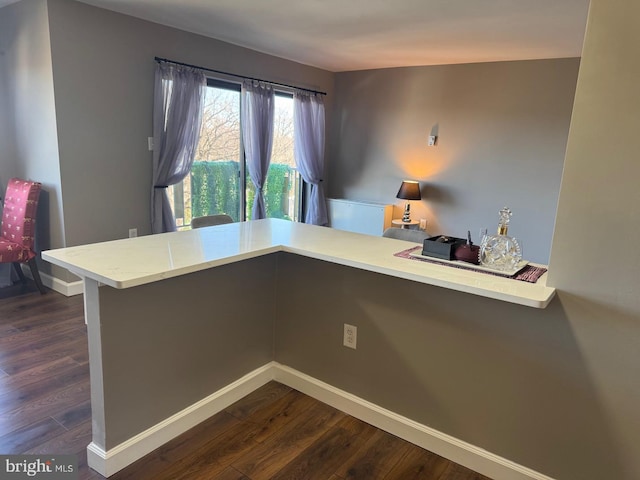 office space featuring dark wood-style floors and baseboards