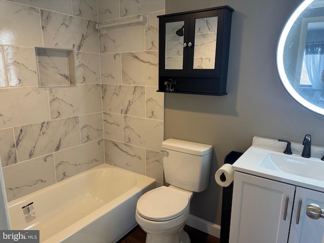 full bath with baseboards, vanity, and toilet