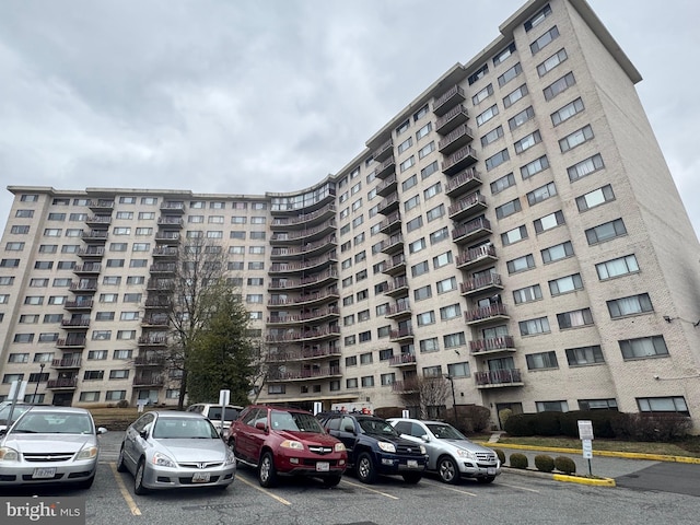 view of property with uncovered parking