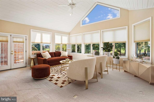 sunroom featuring french doors, wood ceiling, lofted ceiling, and a ceiling fan