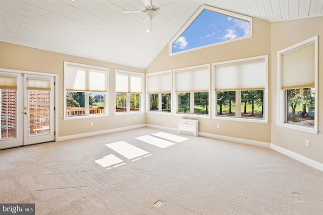 unfurnished sunroom with vaulted ceiling and a ceiling fan