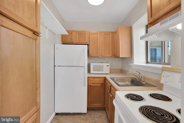 kitchen with light tile patterned flooring, light brown cabinets, white appliances, a sink, and light countertops