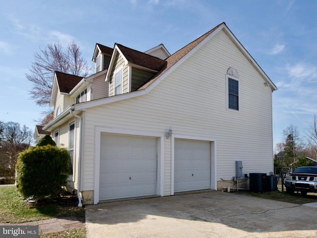 view of home's exterior featuring driveway