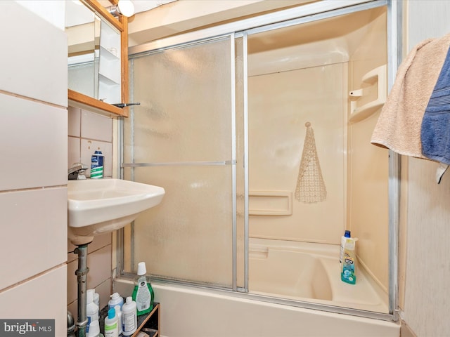 full bath with shower / bath combination with glass door