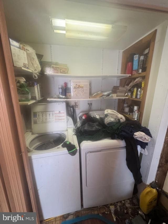 laundry area featuring laundry area and washer and clothes dryer