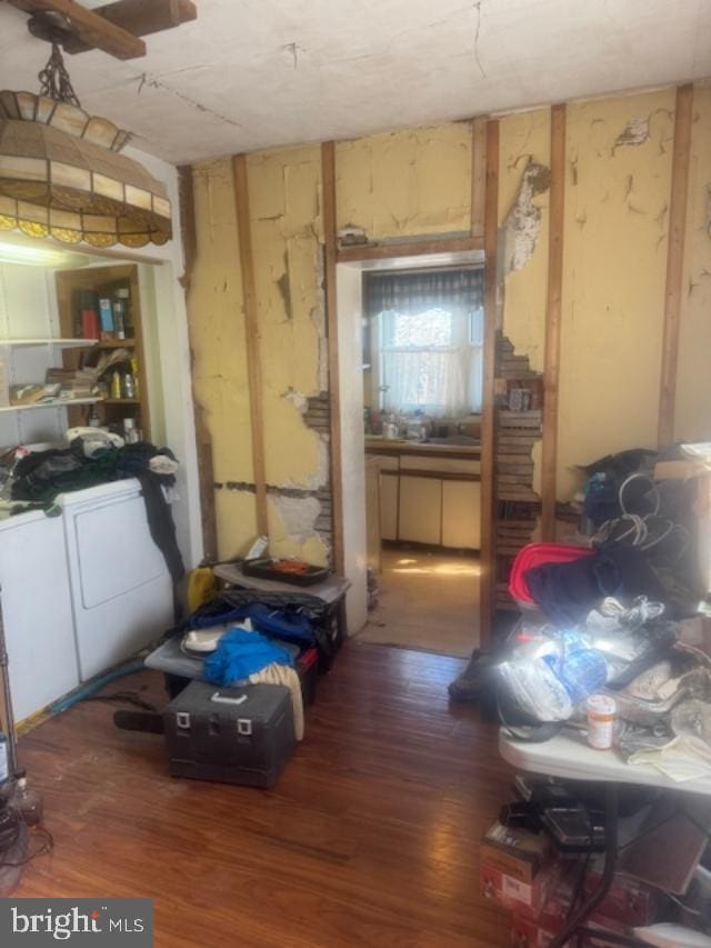 interior space with washing machine and dryer and wood finished floors