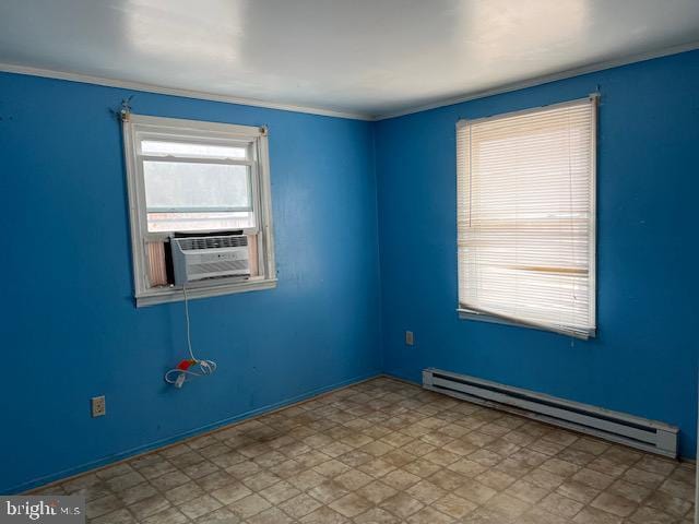 empty room featuring tile patterned floors, baseboard heating, cooling unit, and crown molding