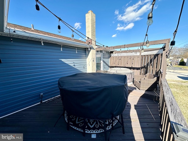 wooden deck featuring fence