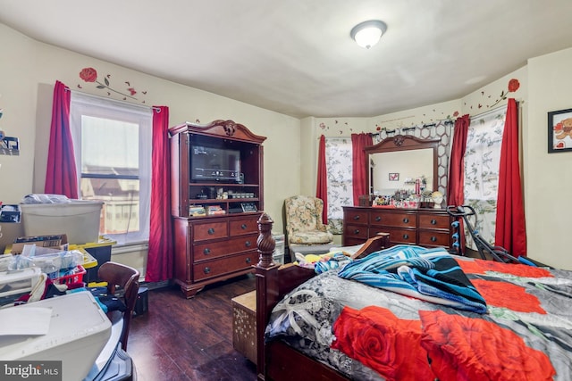 bedroom featuring dark wood-style flooring