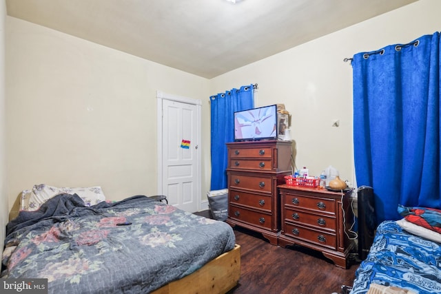 bedroom with wood finished floors