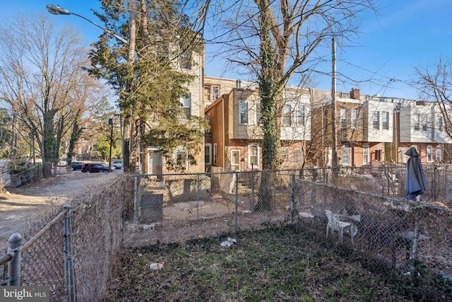 exterior space with driveway and fence