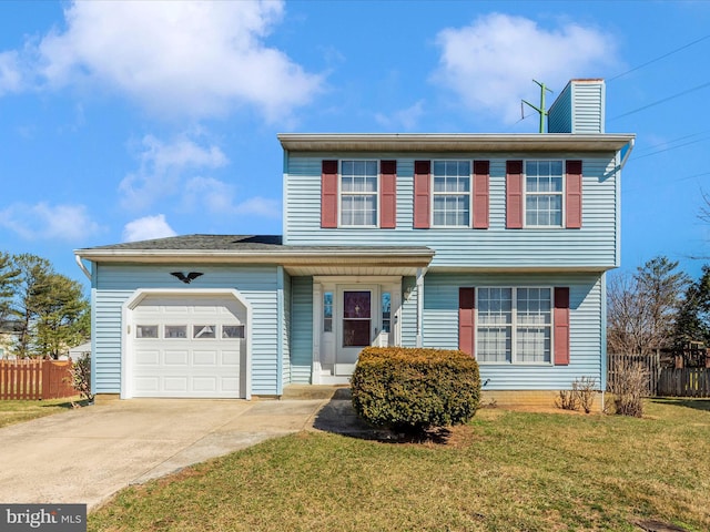 colonial-style house with a front yard, concrete driveway, an attached garage, and fence