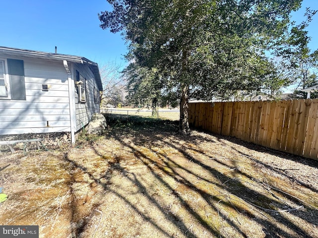 view of yard featuring fence