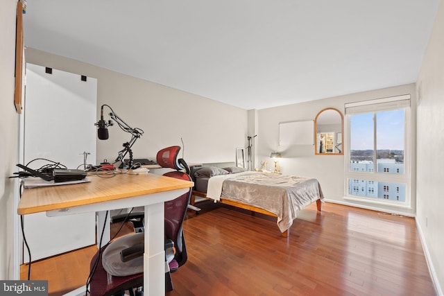 bedroom featuring wood finished floors