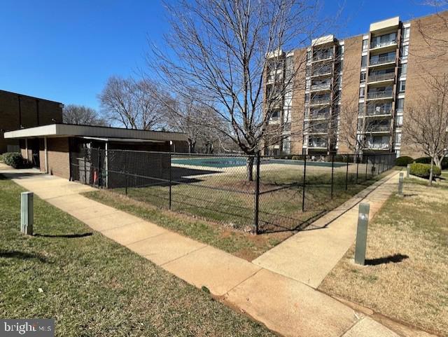 view of community with fence