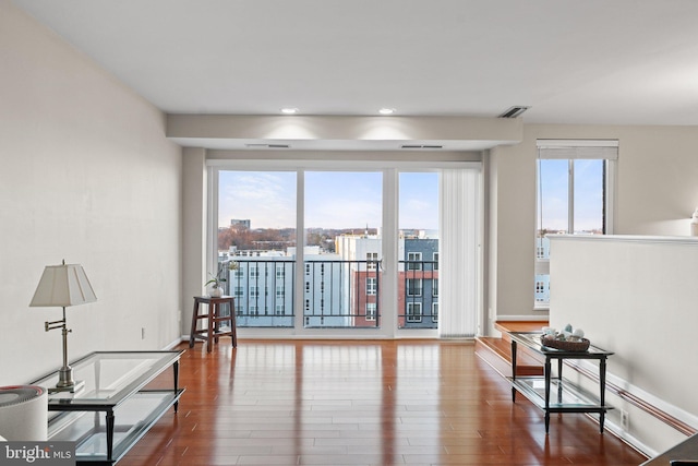 interior space featuring baseboards and wood finished floors