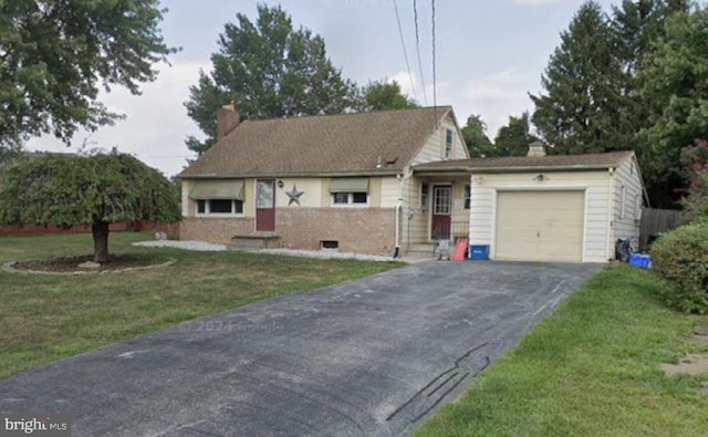 ranch-style home featuring aphalt driveway, an attached garage, brick siding, a chimney, and a front yard